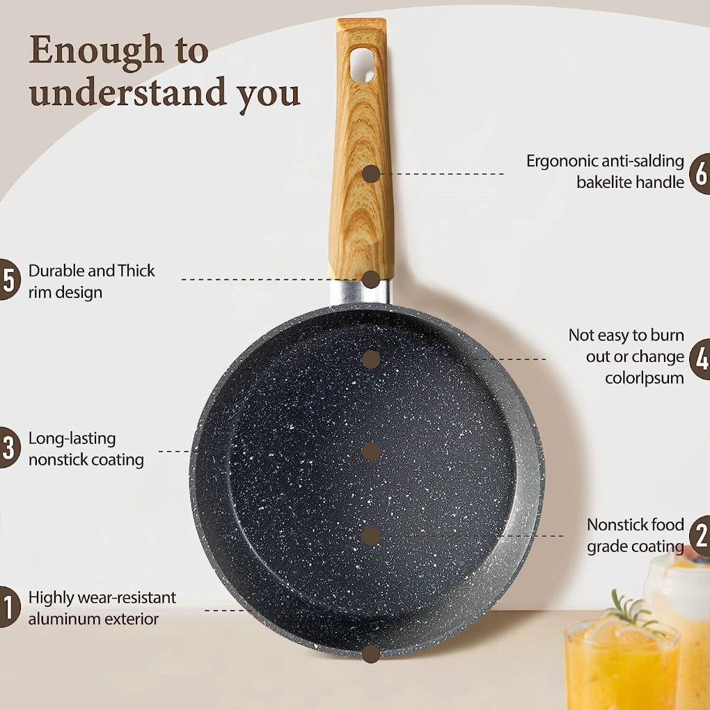 Ergonomic handles & clear lids on a durable nonstick granite coated pot from the 12-piece cookware set.
