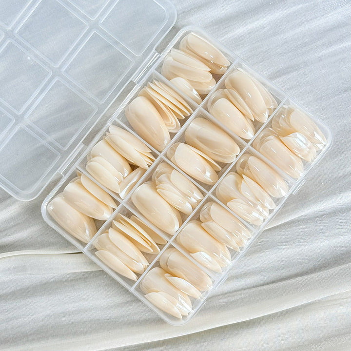 Clear false nail tips for women, 144 reusable press-on nails perfect for custom nail art designs.