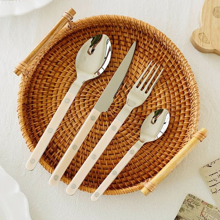 Elegant 24-piece engraved stainless steel dinnerware set, ideal for sophisticated dining.