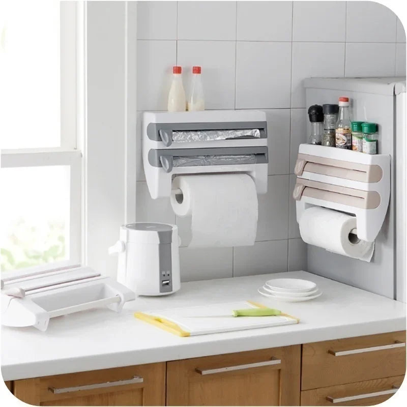Space-saving wall-mounted kitchen organizer with paper towel holder, foil cutter & cling film dispenser.