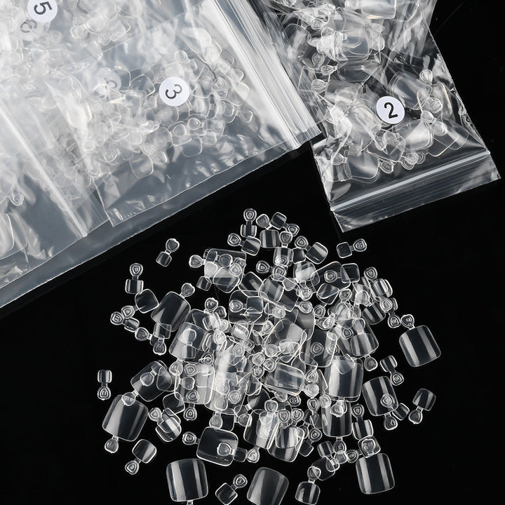 Transparent gel toenail tips (600ct) for flawless professional pedicures & durable DIY nail enhancements.