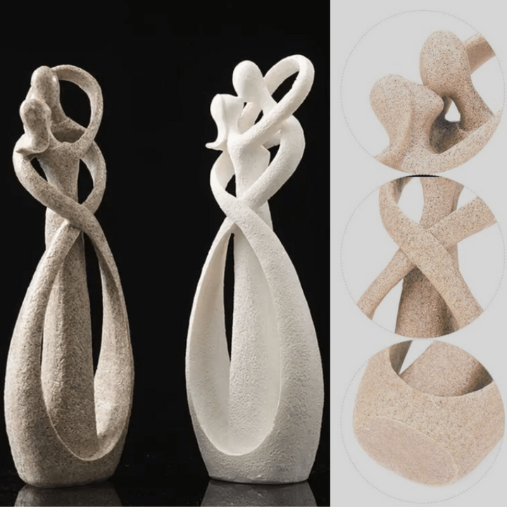 Contemporary abstract love sculpture. This white & brown resin art piece adds a timeless, romantic touch to any home.