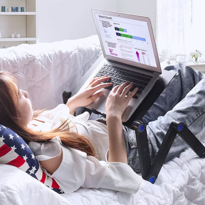 Adjustable ergonomic laptop stand elevating screen for better posture & productivity in home office.