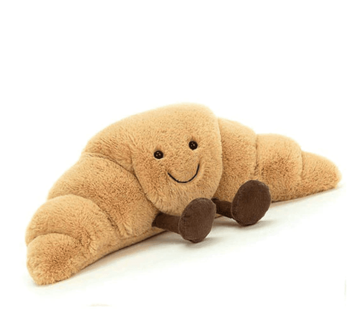 Deliciously soft croissant plush toy. Huggable pastry stuffed animal, great kids toy or unique novelty gift.