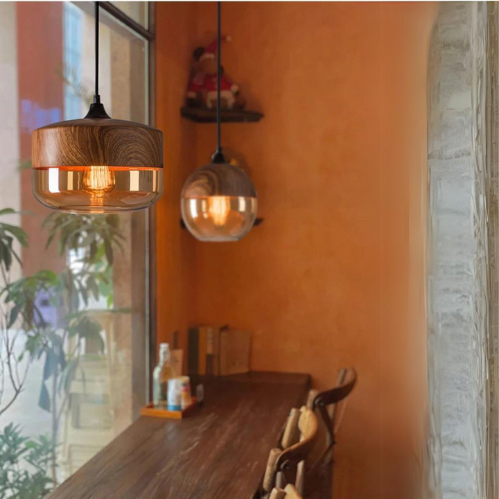 Sustainable wooden pendant lamp, Nordic style, diffusing a soft, warm glow.