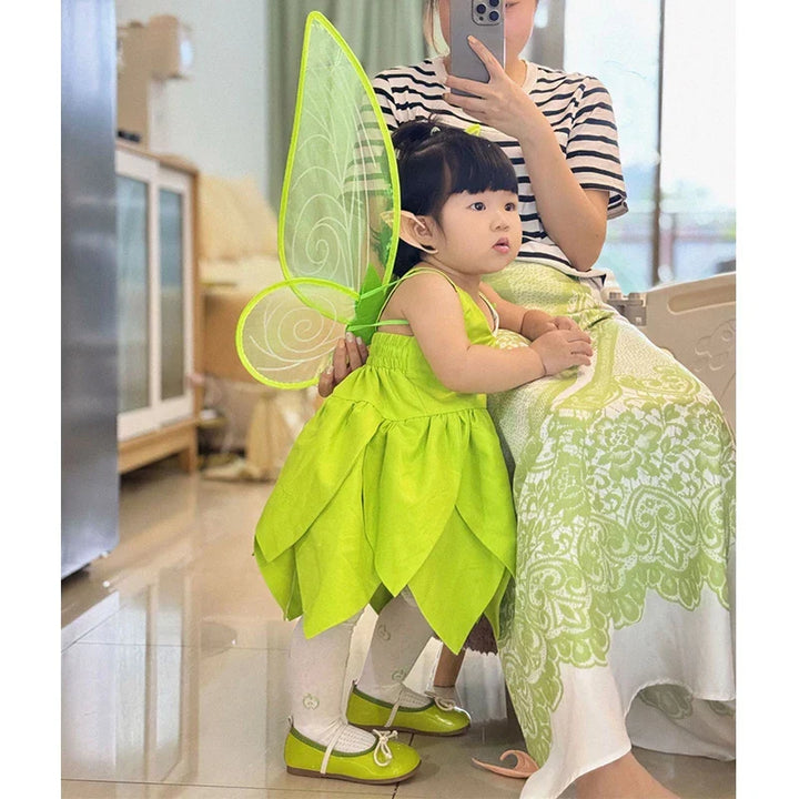Sparkling green Tinkerbell fairy dress-up costume with wings for enchanting children's play.