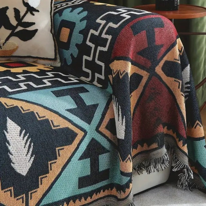 Microfiber bohemian sofa throw with geometric Aztec pattern and tassels, ideal furniture protector.