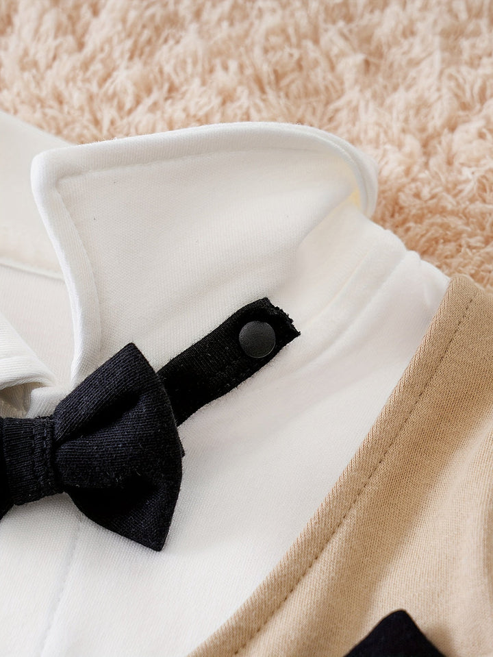 Formal baby boy outfit: a comfortable cotton romper designed in gentleman style with a cute bow tie.