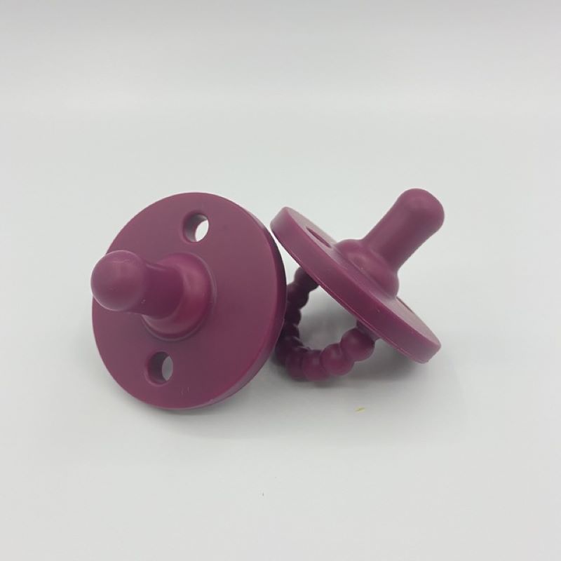 Newborn essential: BPA-free silicone pacifier and teether for ultimate soothing and safety.