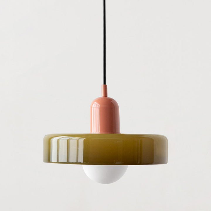 Contemporary artistic Bauhaus lamp, colored glass hanging light, warm glow.