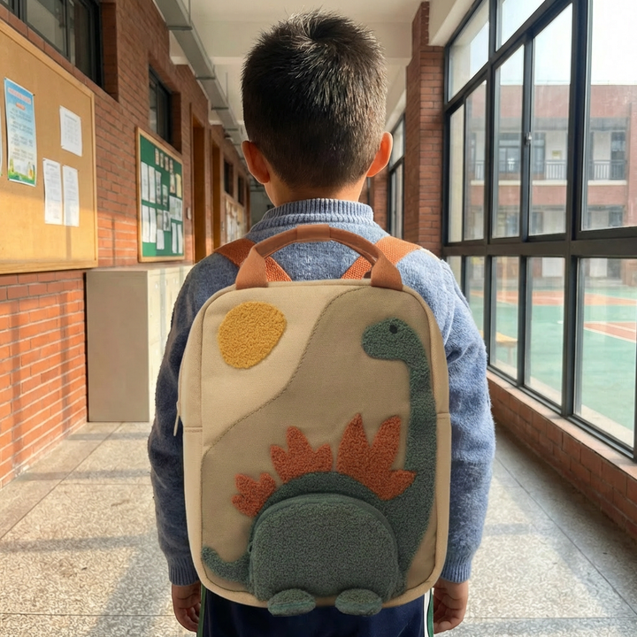 Children's beige school backpack, practical and playful. Features sturdy fabric, adjustable straps, and ample storage.