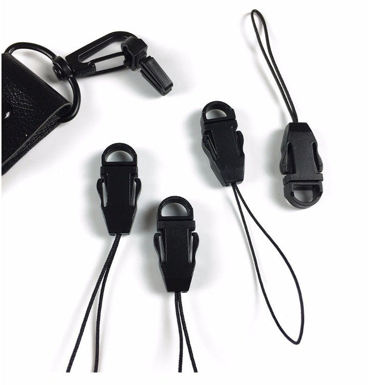 Easy-to-use black cord clips to quickly adjust and secure drawstrings on activewear and outdoor equipment.