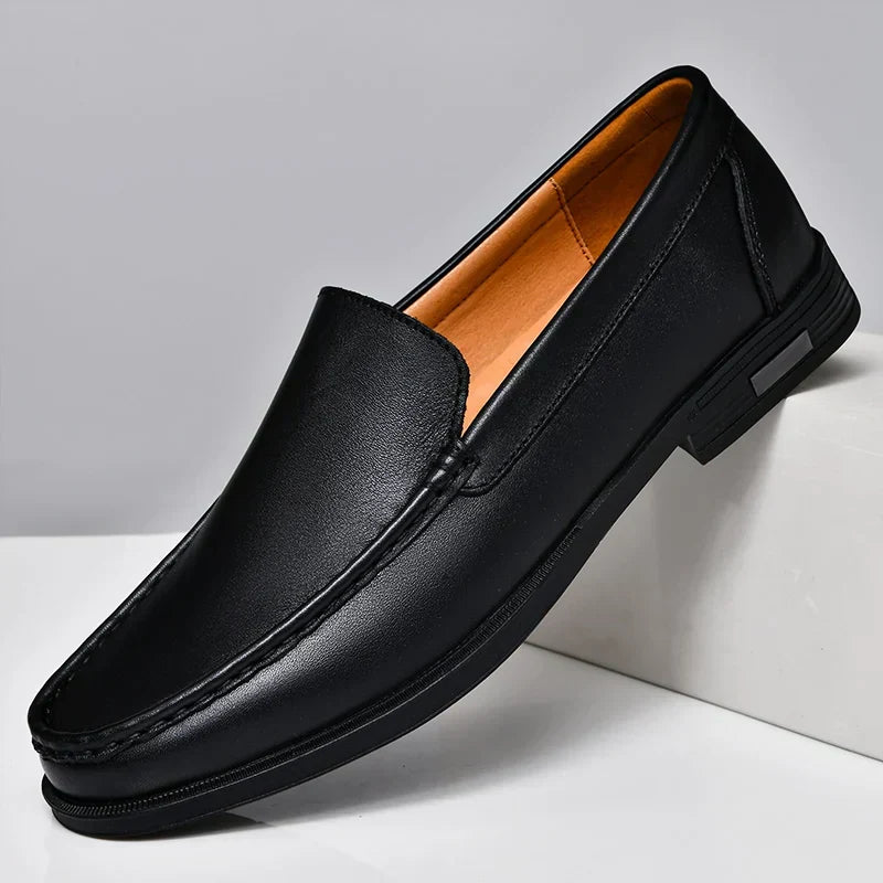 Black classic slip-on men's loafers, emphasizing style and comfort for everyday wear.