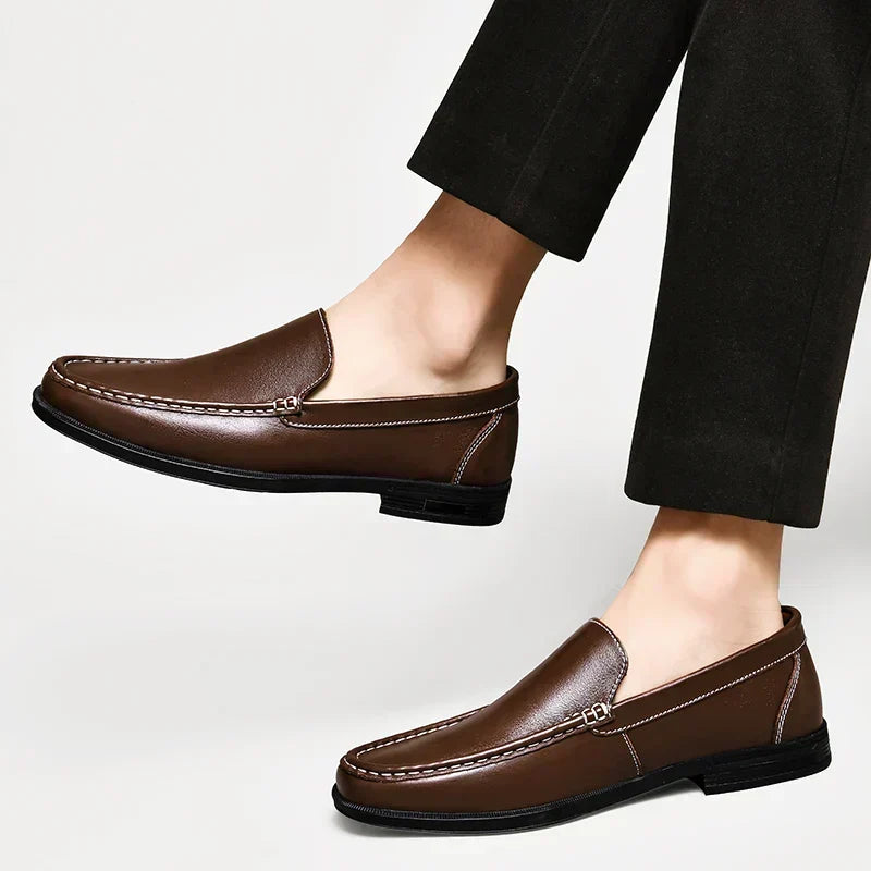 Classic brown men's slip-on loafers, combining fashion, comfort, and versatility.