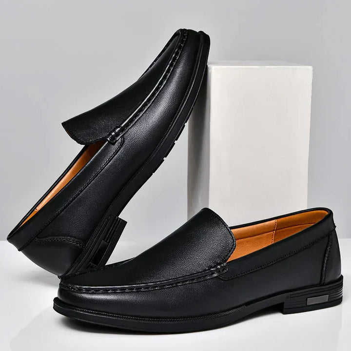 Stylish men's slip-on dress shoes in black, offering elegance and comfort.