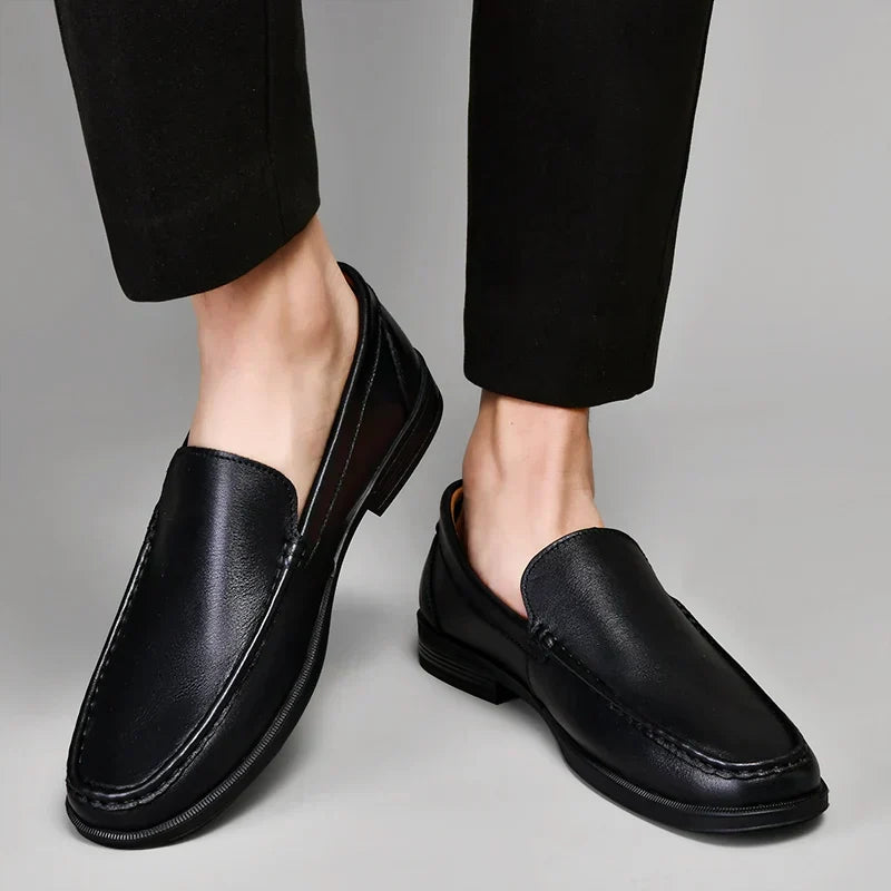 Men's black classic loafers, versatile for formal events or casual outings.