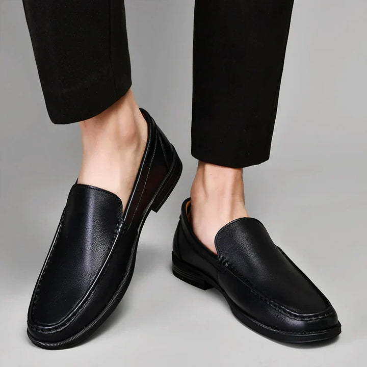 Men's black classic loafers, versatile for formal events or casual outings.