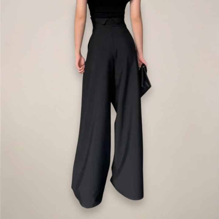 Effortless women's wide-leg high-waisted pants. Perfect black trousers for comfortable, chic summer fashion.
