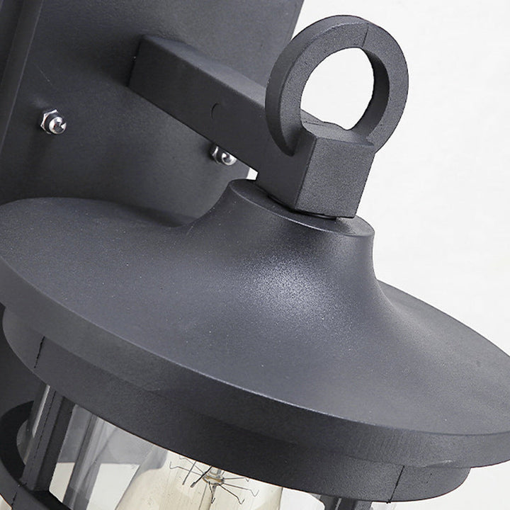 Sleek black industrial wall lamp, weatherproof aluminum sconce enhances modern outdoor spaces.