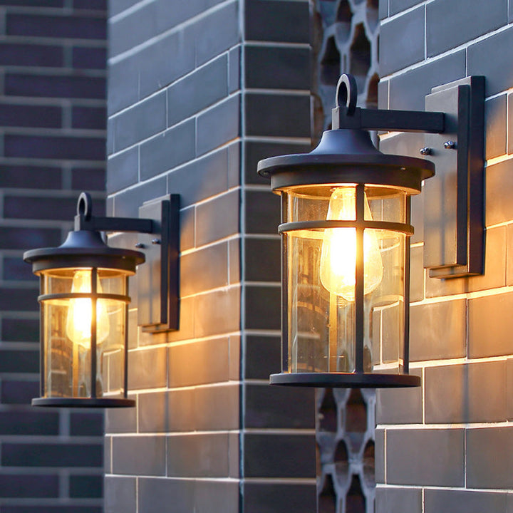 Hardwired outdoor lighting: black industrial wall sconce, weatherproof and durable for any exterior.