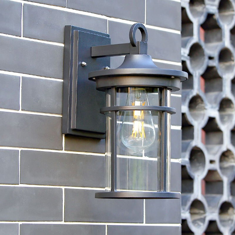 Modern industrial black wall sconce, aluminum garden light fixture with glass shade, outdoor rated.