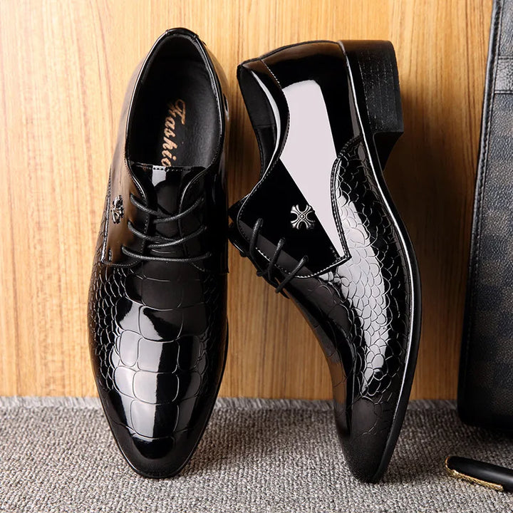 Sleek men's black leather Oxford shoes featuring polished finish, perfect for sophisticated formal and business wear.