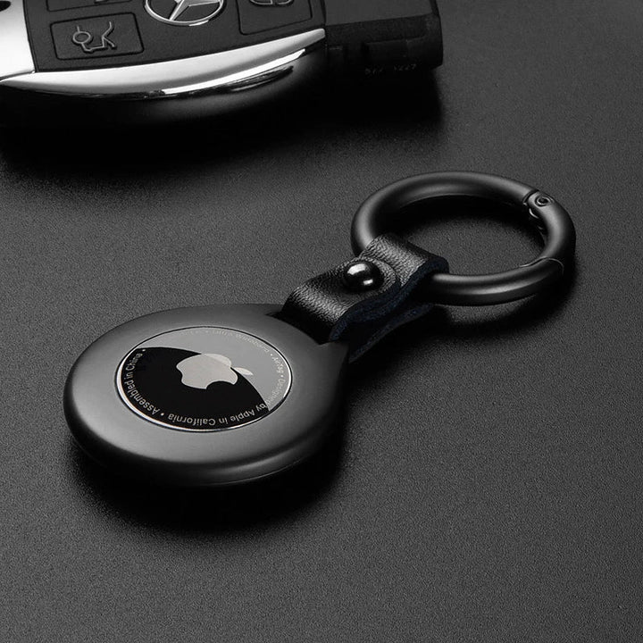 Luxury black leather tracker case with metal accent, elegant key finder protection.