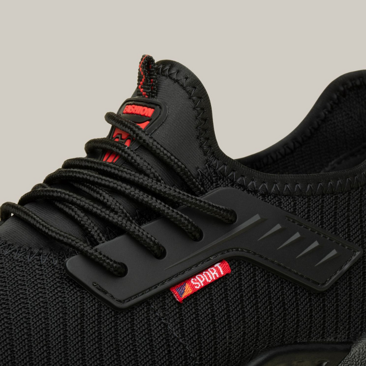 Side view of black men's lightweight safety work shoes with durable design and protective toe cap.