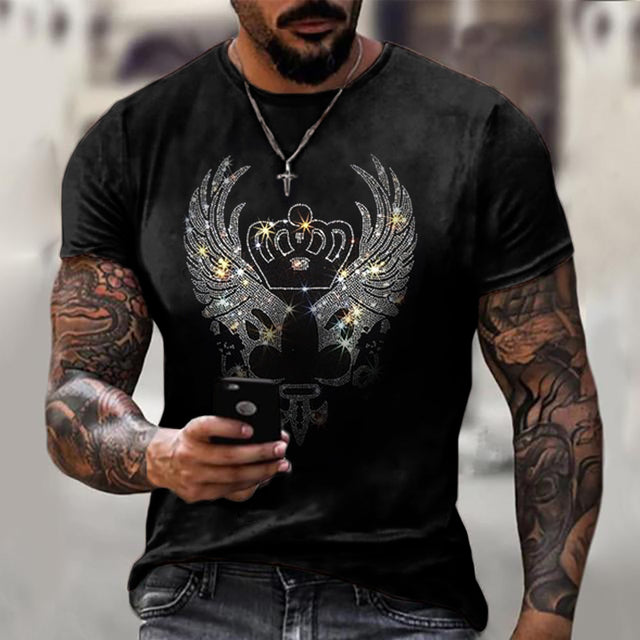 Close-up of the glittering rhinestone crown graphic on a black men's slim fit t-shirt.