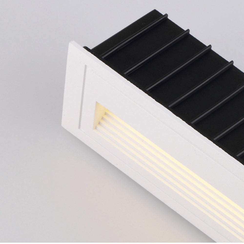 Modern white LED step light designed for easy hardwired installation.