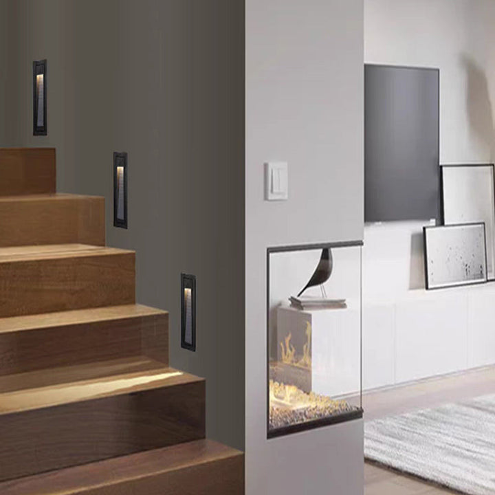Grey square outdoor LED step light for modern decking.
