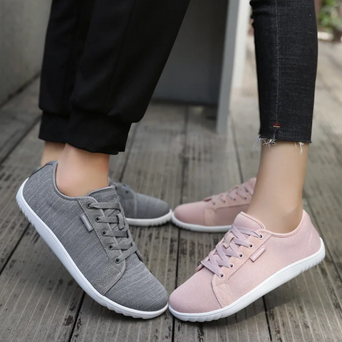 Black unisex zero-drop comfort walking shoes with wide toe box & cushioned sole, perfect for natural movement.