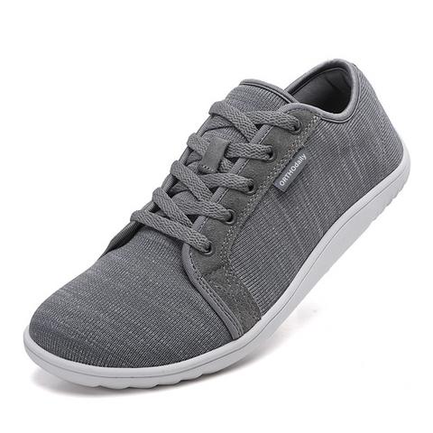 Rear view of black zero-drop comfort shoes, emphasizing natural heel height and slip-resistant sole.