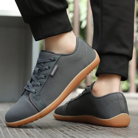 Front view of gray zero-drop comfort shoes, highlighting the wide toe box for natural foot splay.