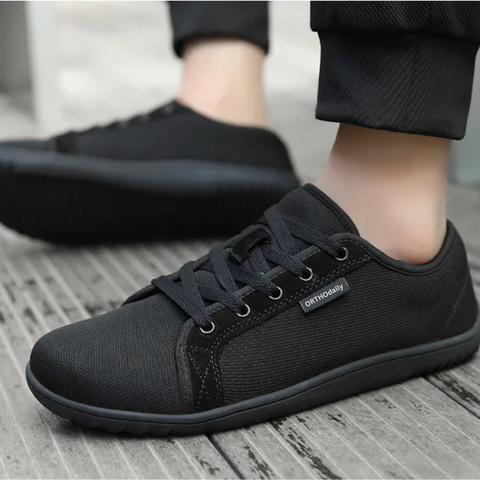 Top view of white unisex zero-drop walking shoes with secure lace-up closure for all-day comfort.