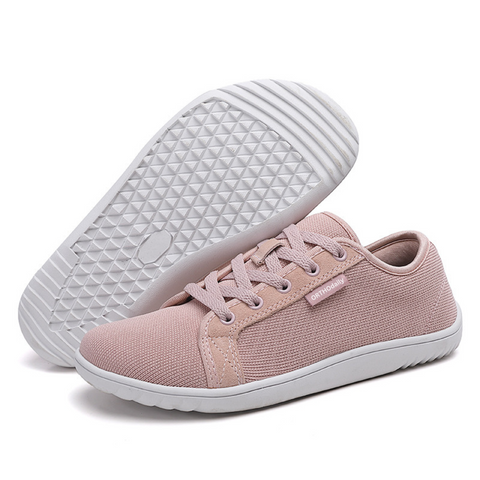 Pair of black and white unisex zero-drop comfort shoes, ideal for natural walking and daily wear.