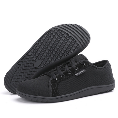 Close-up of lace-up detail on gray unisex zero-drop walking shoe, ensuring snug, secure fit & comfort.
