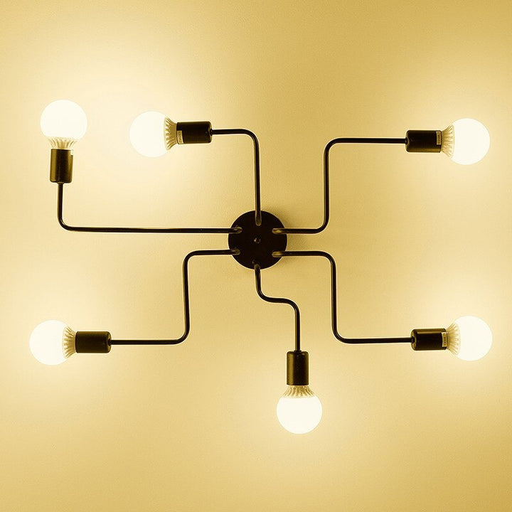 Sleek black vintage industrial flush mount ceiling light, perfect for contemporary spaces.