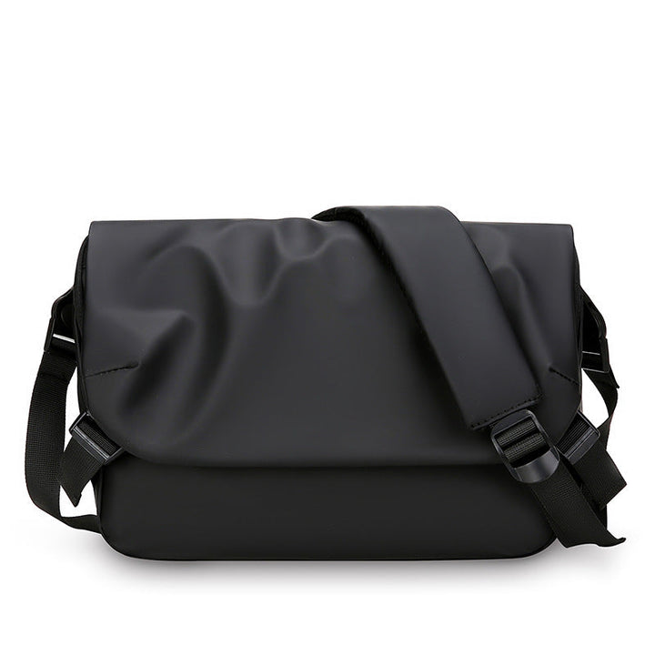 Sleek black waterproof messenger bag, ideal for daily commute. Versatile unisex design for laptops & travel.