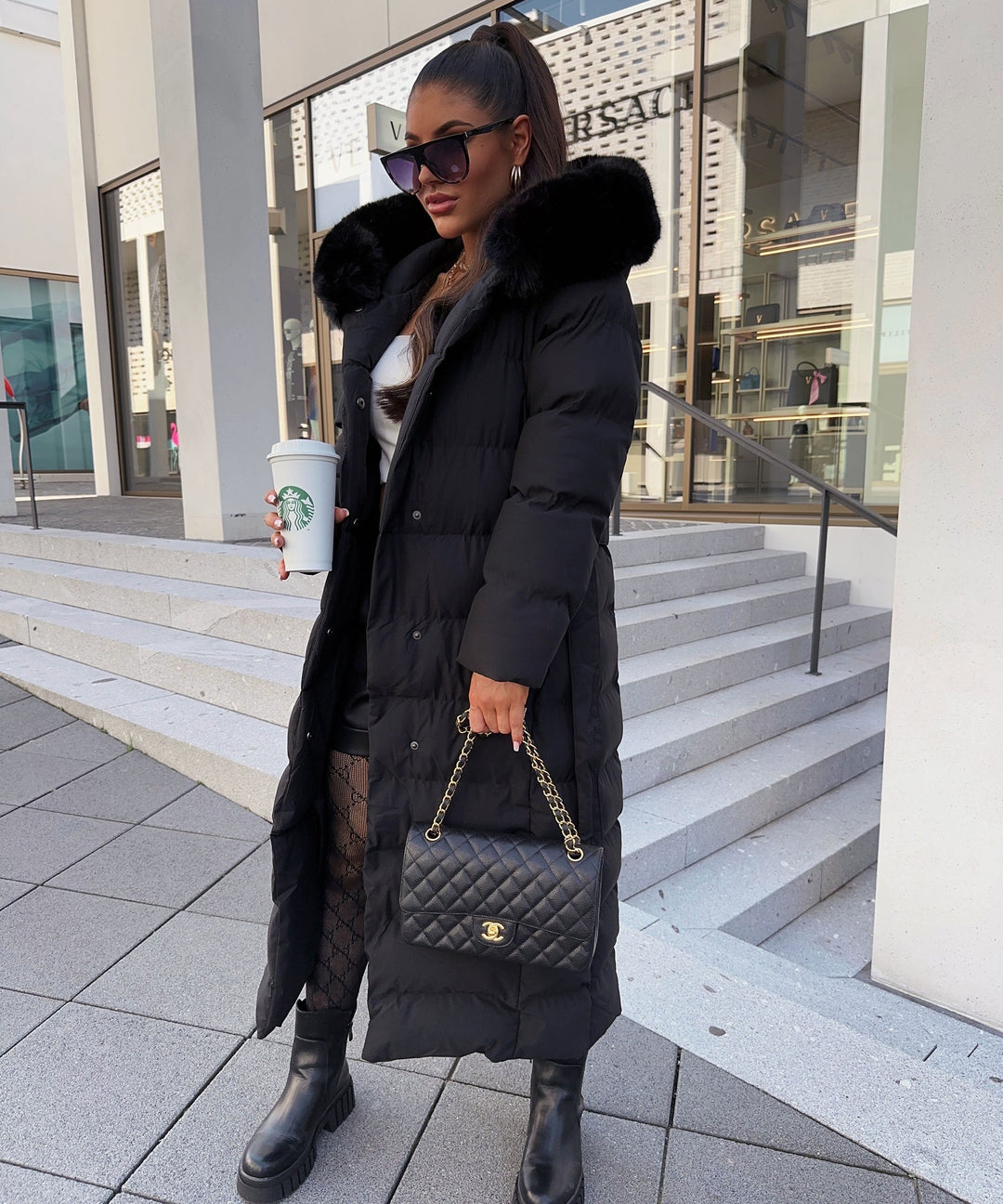 Black women's belted puffer winter coat for ultimate warmth & style in cold weather.