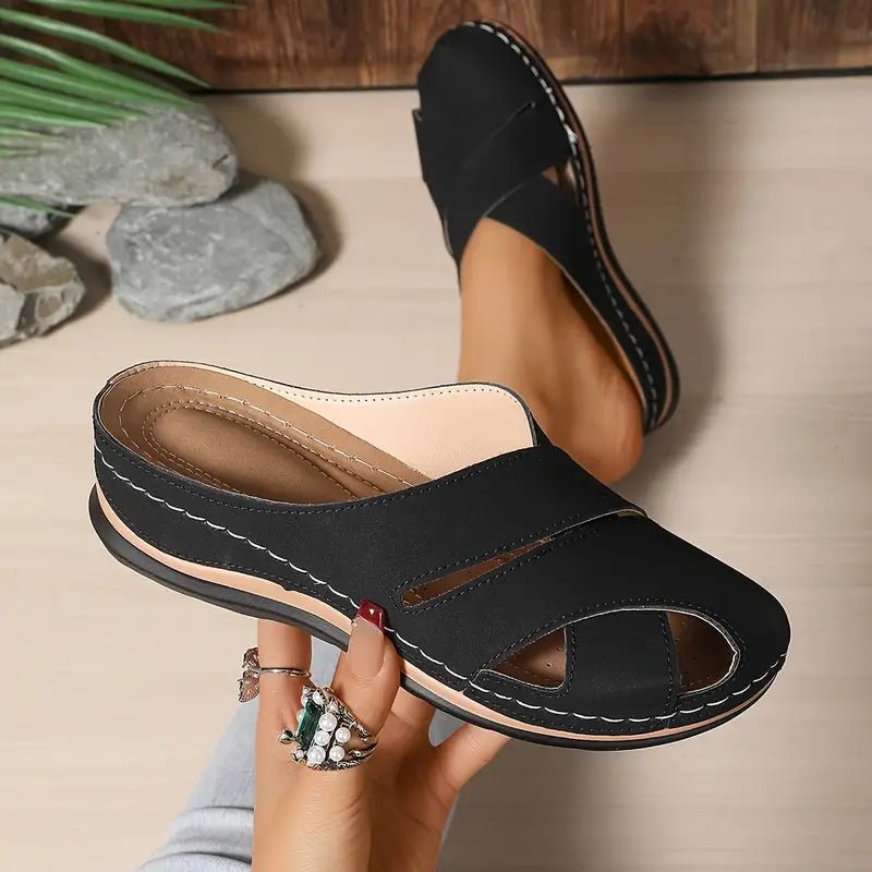Black women's breathable cross-strap mule sandals. Comfortable flat slip-on summer casual footwear.