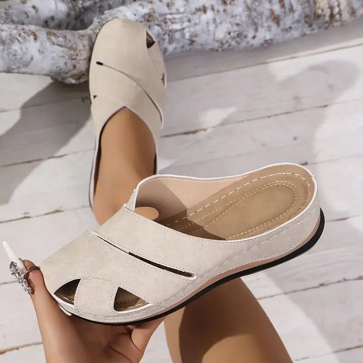 Beige women's breathable cross-strap mule sandals. Ideal flat slip-on summer casual footwear.