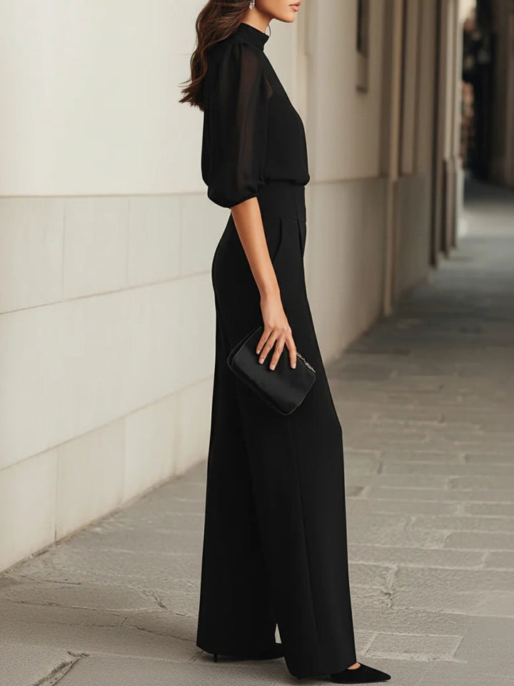 Women's sophisticated black 3-piece outfit: sheer camisole, wide-leg trousers & matching top.