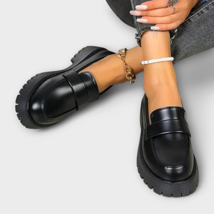 Chic women's black orthopaedic loafers, perfect for everyday wear, offering superior comfort and foot support.