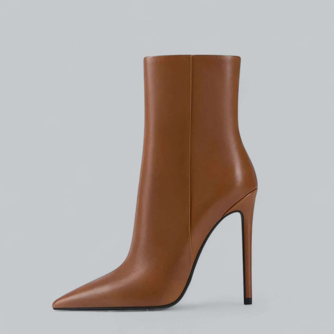 Black women's pointed toe stiletto ankle boots, elegant high heel footwear.