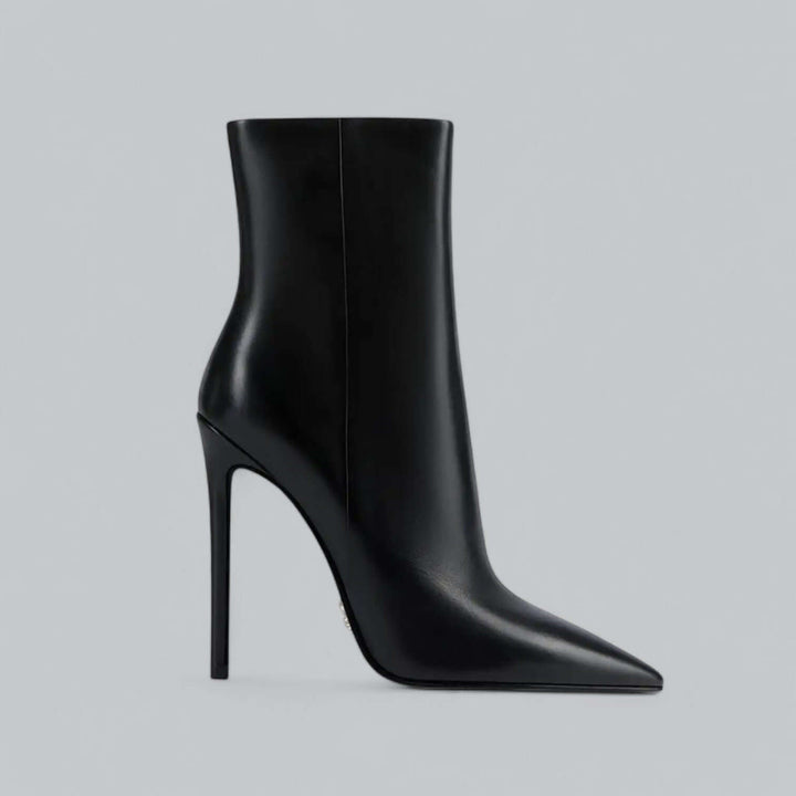 Stylish women's black pointed toe stiletto ankle boots, elegant high heel footwear.