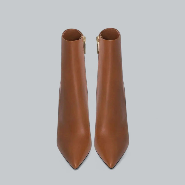 Sleek stiletto heel on women's pointed toe ankle boots, high heel fashion detail.