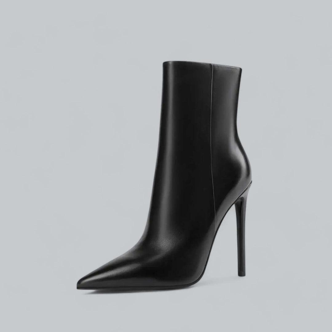 Women's black pointed toe stiletto ankle boots, sophisticated high heel footwear.