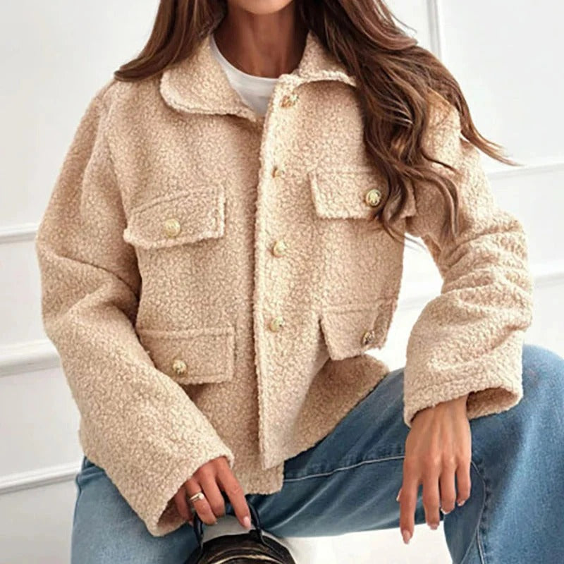 Brown chic women's short jacket. Versatile modern outerwear for casual fall and winter style.