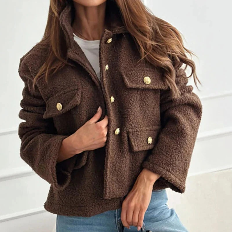 Elegant beige women's short coat. Structured fit outerwear, ideal for modern fall & winter fashion.